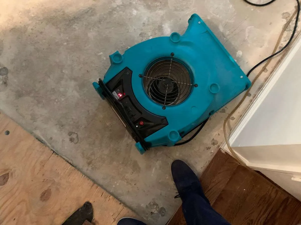 Air mover drying subfloor during Leak Detection & Repair in Brainerd